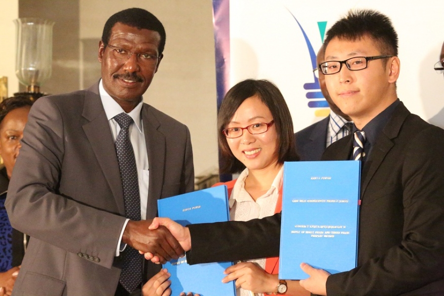 Kenya Power MD & CEO, Dr. Ben Chumo (left), Shenzhen Inhemeter Company Ltd Regional Manager, Salinger Sheng (center) and Wonder Zhou.